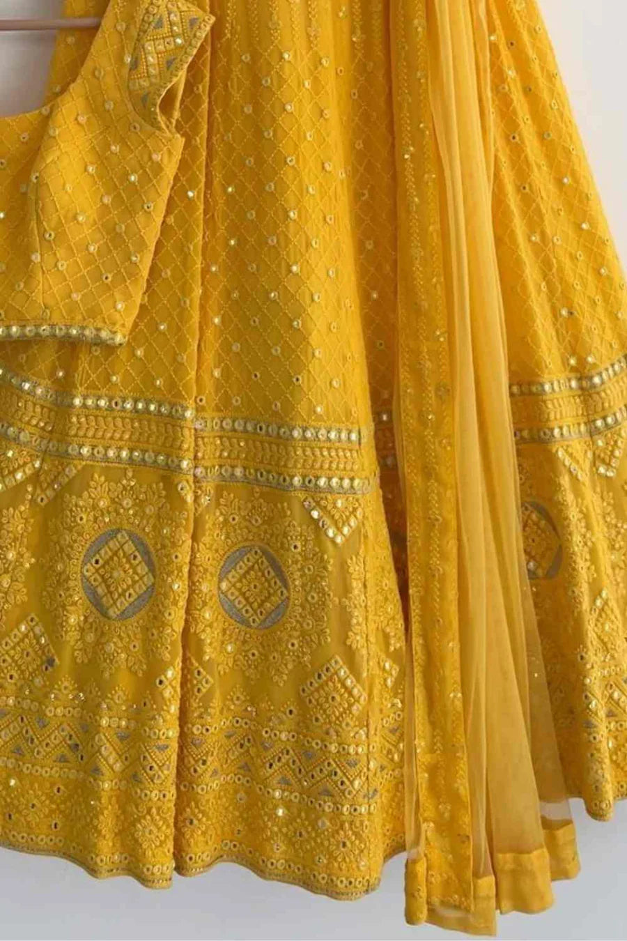 YELLOW COLOR FULLY FLARED LEHENGA CHOLI WITH INTRICATE EMBROIDERY